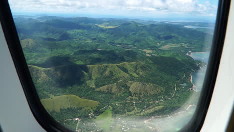 view of a mountain range in an airplane window