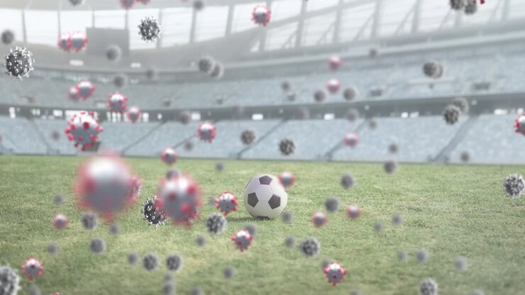 Cellule Covid-19 contro un pallone da calcio in uno stadio sportivo