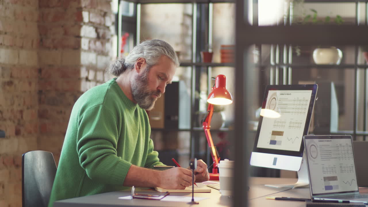Businessman working on data analysis in office