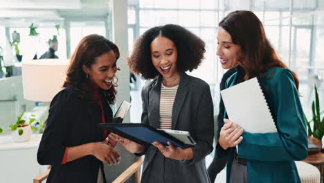 three businesswomen meeting in an office