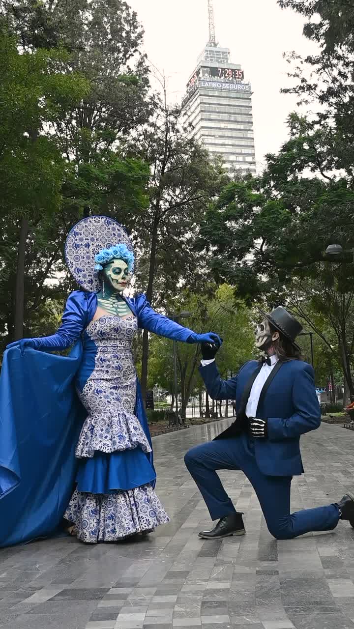 Day of the Dead, couple in vibrant costumes in the Alameda Central park during the Day of the Dead celebrations