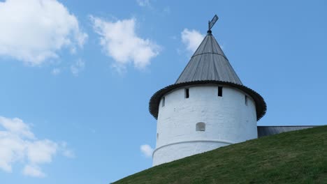 old white tower against blue sky