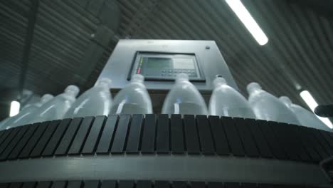 conveyor belt with bottles of drinking water at a modern beverage plant