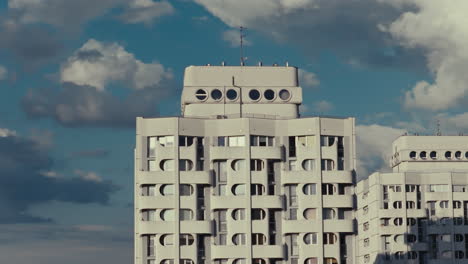 modernist apartment building under a cloudy sky