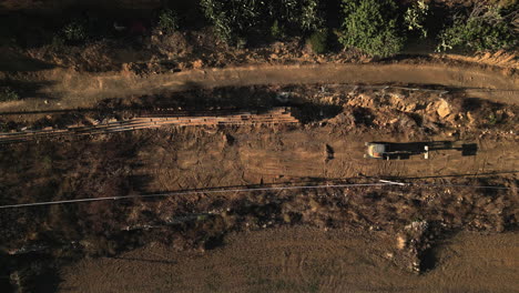 aerial top down view of an excavator landscaping