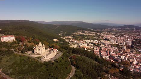 drone rotate around viana do castelo cathedral old town with epic landscape view on the ocean and coastline of portugal