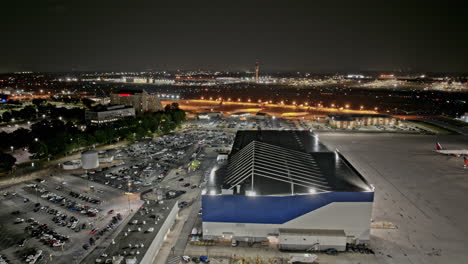 Atlanta-Georgia-Aerial-v886-hyperlapse-ATL-Hartsfield-Airport-activities,-airplanes-taking-off-and-landing-on-the-runway-and-aircrafts-parked-at-cargo-building---Shot-with-Mavic-3-Pro-Cine---June-2023