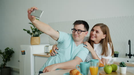 couple taking a selfie during breakfast