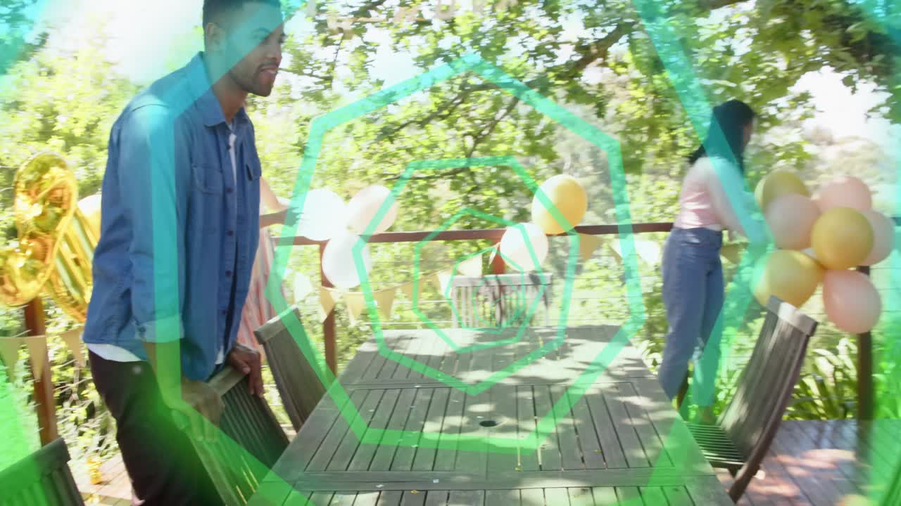 Arriving, four friends arranging chairs, tying balloons on deck for events, green spiral overlaying