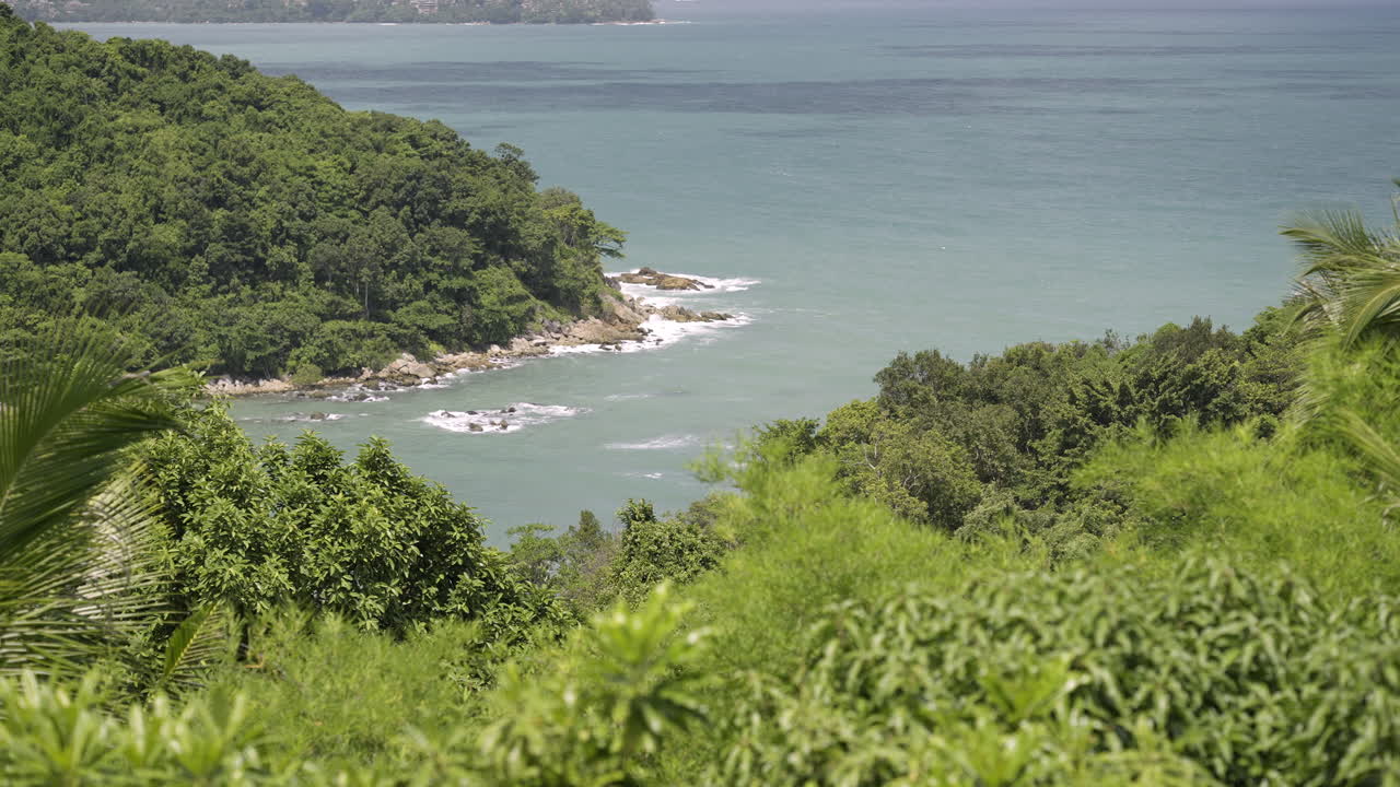 Panoramic View of a Lush Tropical Coastline and Serene Ocean Bay