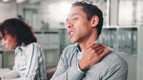 man with shoulder and neck pain in office