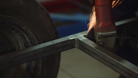 grinding metal with sander at metal industry factory