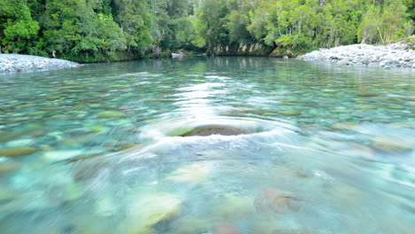 time lapse of the clear blue river waters flowing of the huequi river in southern chile