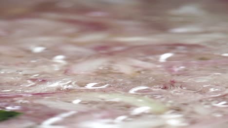 red onions frying in oil