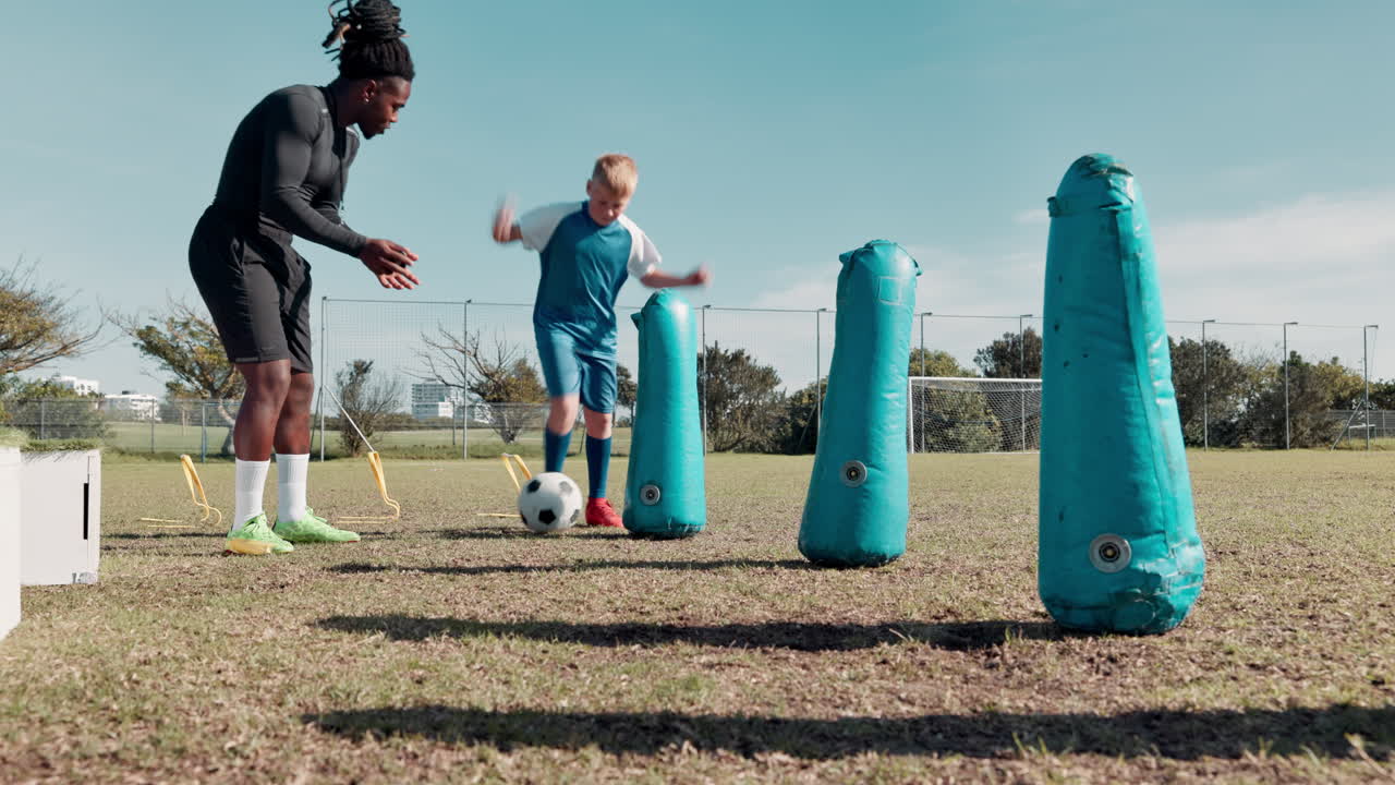 Soccer training session with coach and young player