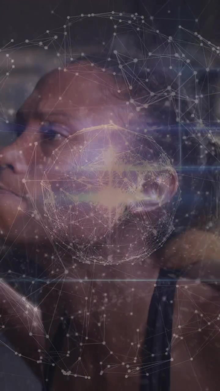 Vertical video: Athlete shifting head and arms, activating network globe over chest for training