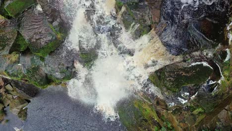 aerial drone footage of a tall rocky waterfall in the yorkshire dales, pennies