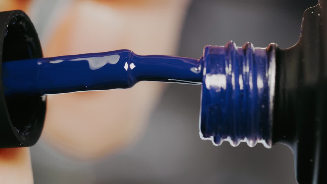 Applying Dark Blue Nail Polish