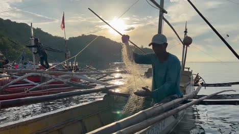 a few boats docked on shore hauling their daily catch of fish