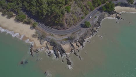 aerial topdown of borderline beach and captain cook highway in wangetti, queensland, australia