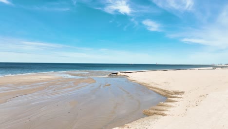 a long pipe carrying sand from the lakebed