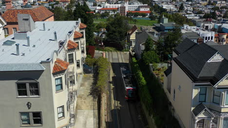 AERIAL:-Light-rail-public-transport-vehicle-in-the-suburbs-of-San-Francisco