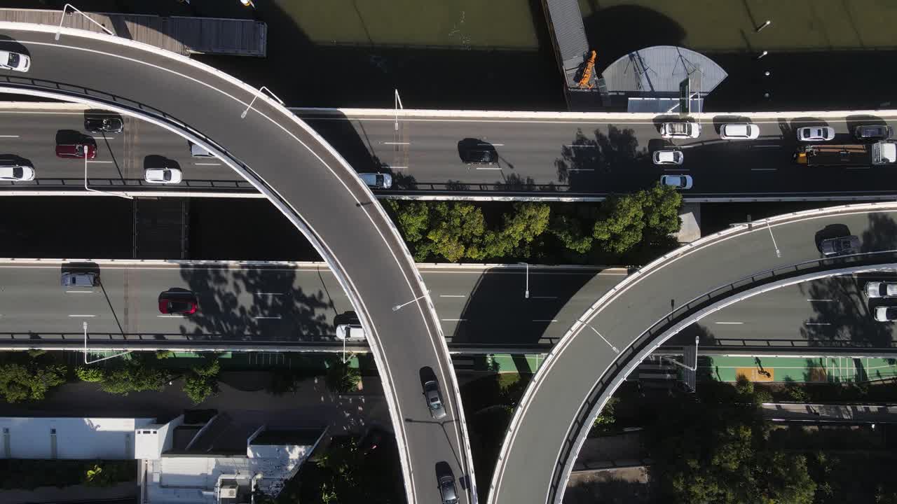 Network of overpasses and intertwining roads connecting the Central Business District along the Brisbane River. Aerial view
