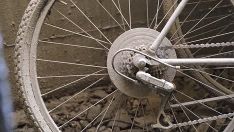 two abandoned bikes with flat tires left leaning