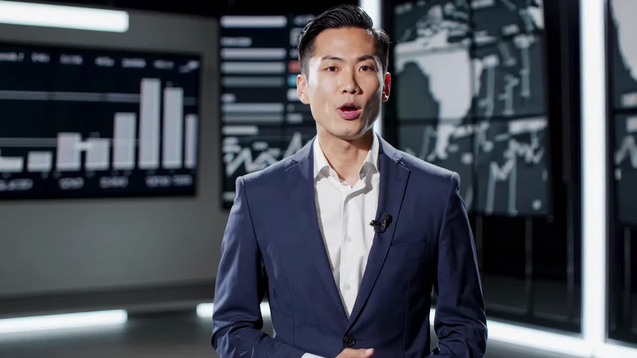 Businessman in a suit presents financial data in a modern studio