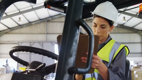 female technician writing in clipboard 4k