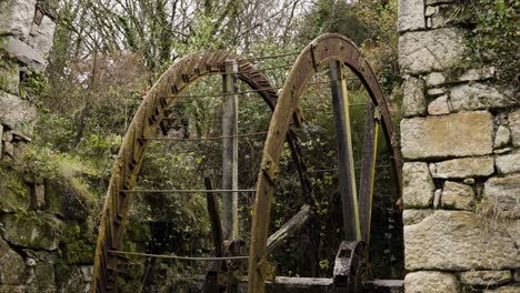 old water wheel in st austell china stone quarry and mills in the tregargus valley near st stephen, cornwall