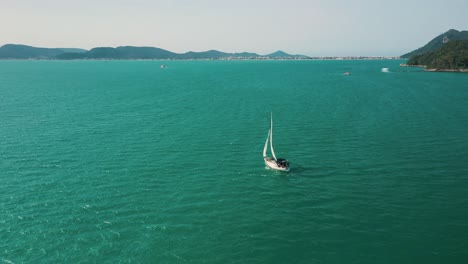 aerial view of a sailboat on the beautiful brazilian ocean, santa catarina, brazil