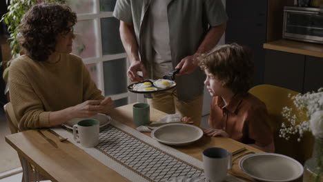 family enjoying breakfast together