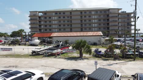 destin marina with world class pageantry, llc company building in background during sunny summer day by the destin crab island, florida, usa