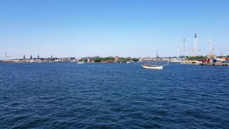 view of the blue ocean and coastline. view of the city and the ocean from the board of the ship.ships and yachts sail on the blue ocean.