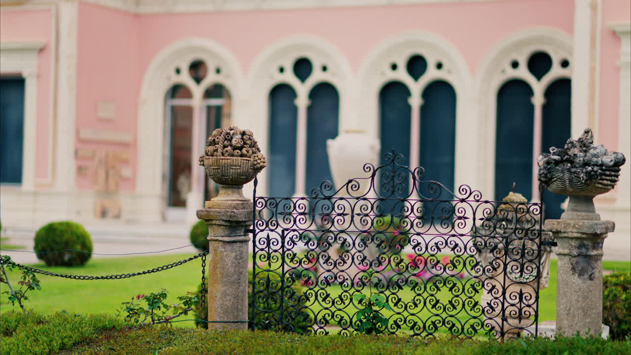 Close up of a decorative stone pillar in the courtyard of Villa Ephrussi de Rothschild with a blurred view on the background