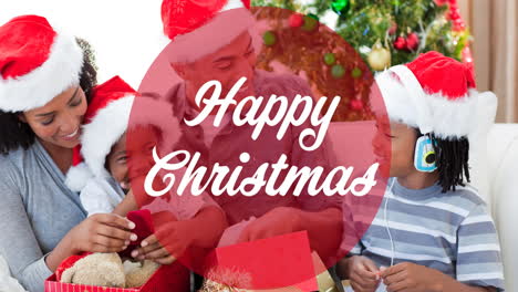 animation of happy christmas in circle over african american family in santa hats opening presents