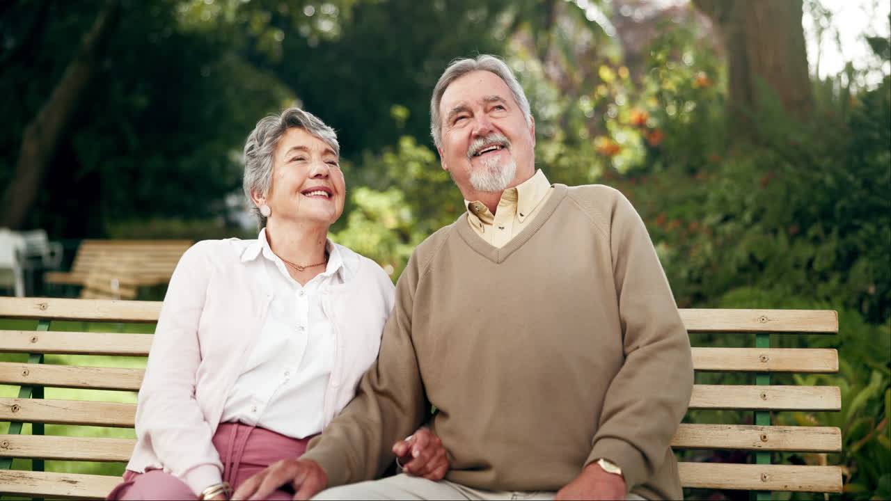 Happy senior couple enjoying time in the park