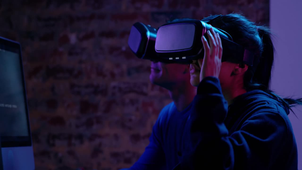 Woman and man using VR headset