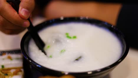 stirring and savoring a bowl of porridge