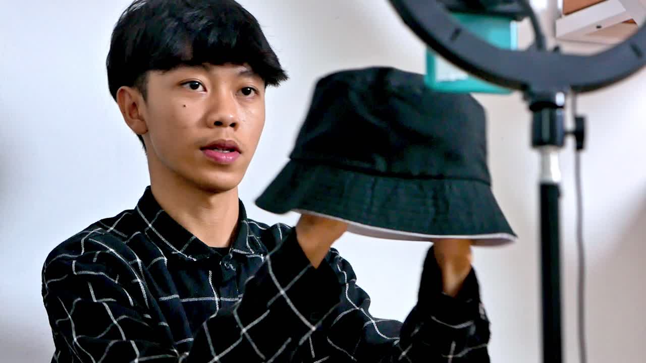 Excited influencer unboxing fashion product livestreaming review for followers online now