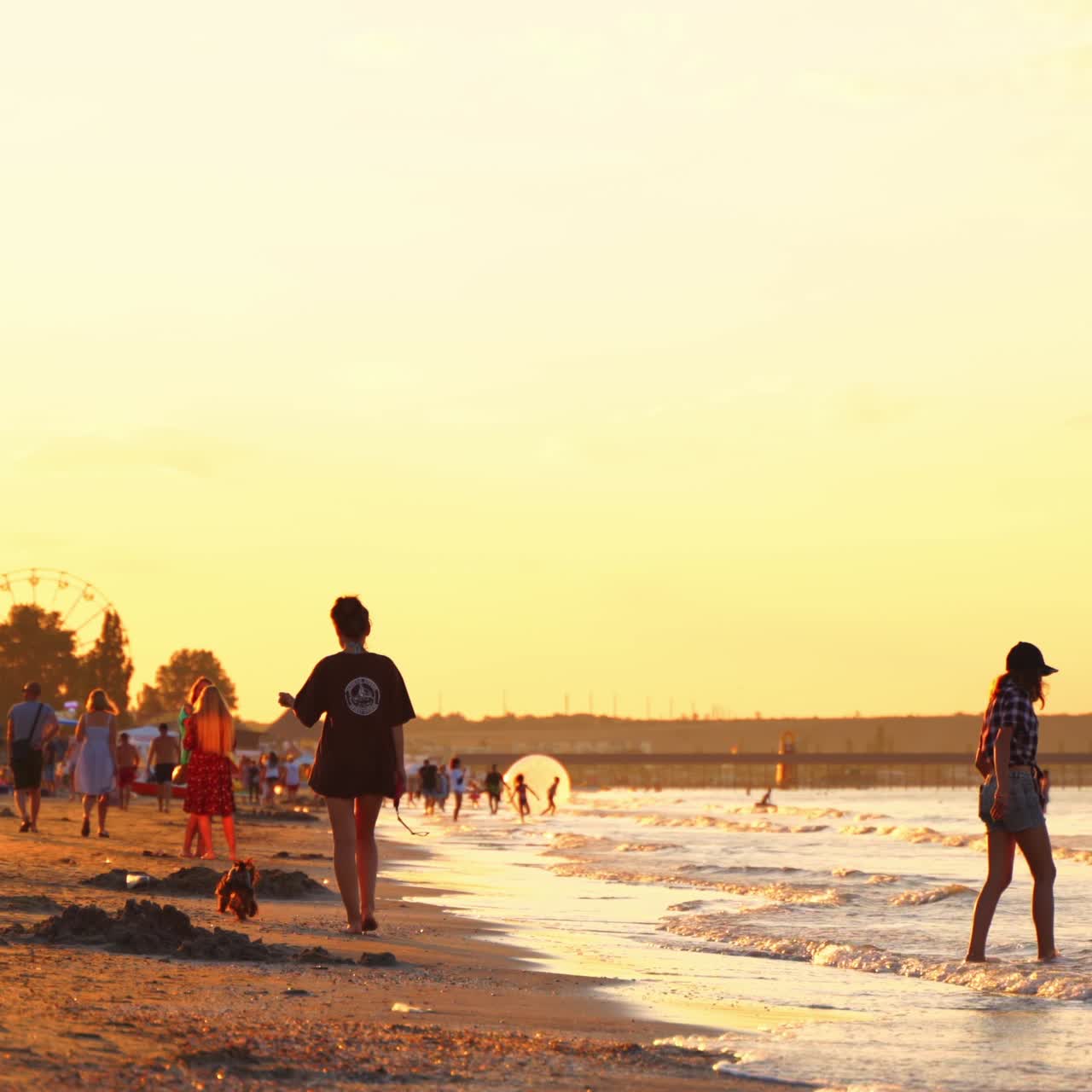 People walking along beach