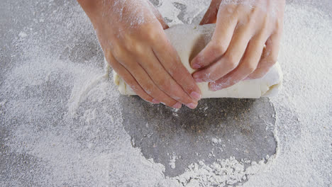 Woman-kneading-a-dough-4k