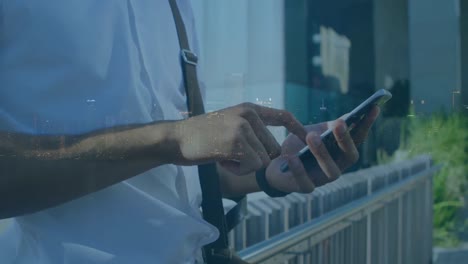 animation of man using smartphone over cityscape