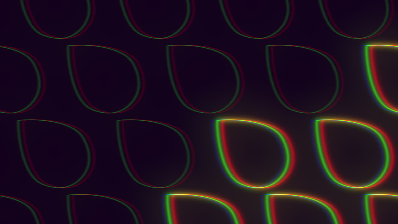 A colorful abstract design featuring a circular arrangement of lines, triangles, and rectangles in various shades of green, red, and yellow