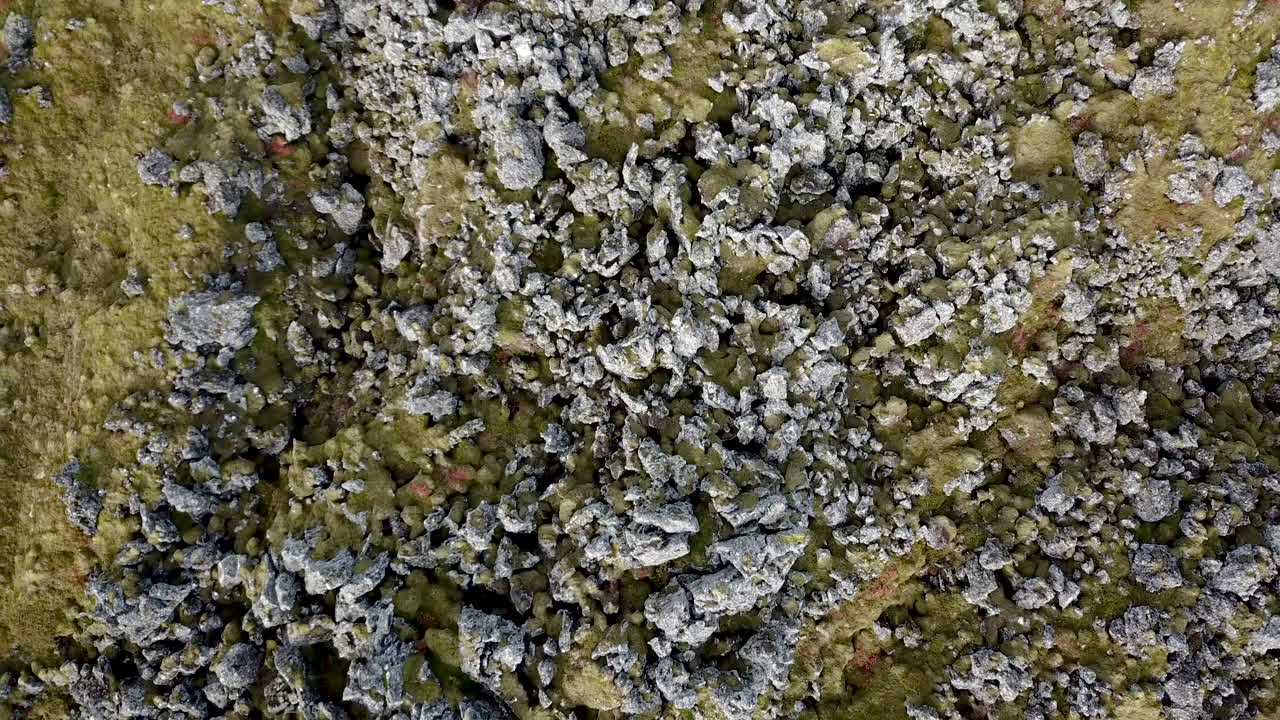 Aerial rotating take off showing sharp edges of lava field