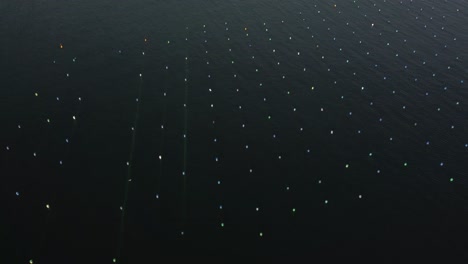 aerial top down shot of mussel farms, ocean farming in the mediterranean.