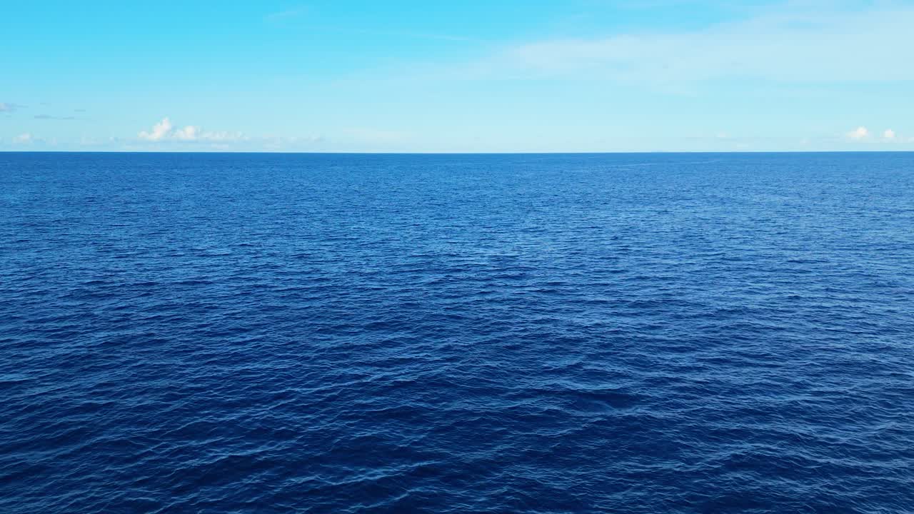 Steady aerial view of gentle ocean waves with open horizon, ideal for calm and relaxing backdrops