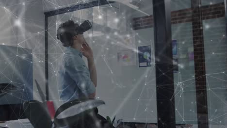 animation of network of connections over businessman using vr headset in office