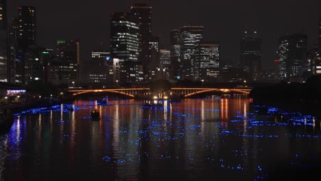 beautiful evening in osaka japan, lanterns in okawa river for tanabata